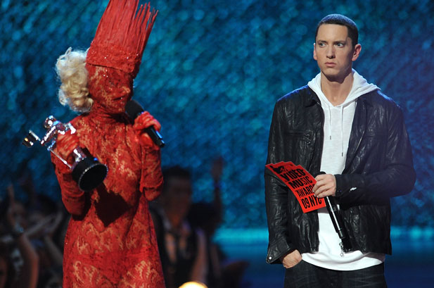 Eminem gives Lady Gaga the old sideways glance as the cloaked pop star 